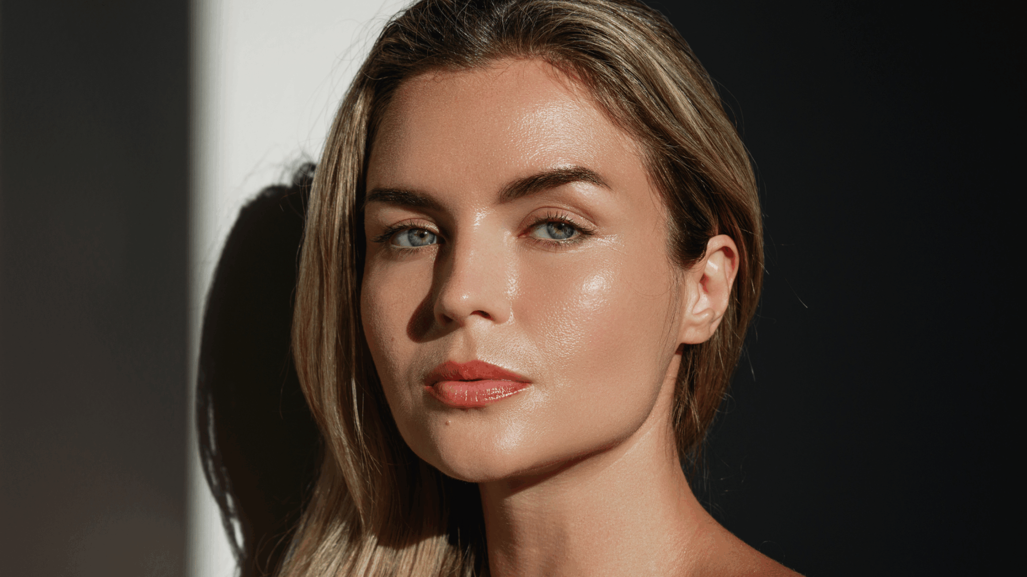 Close-up of a woman with smooth, glowing facial skin