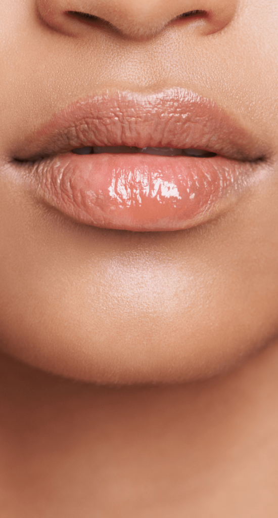Close-up of a woman's lips and chin with a smooth, natural contour